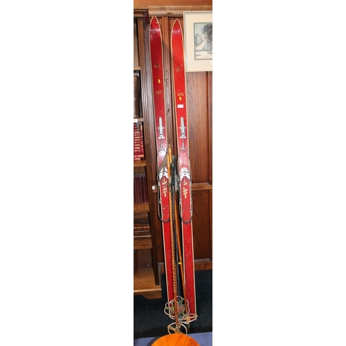 269A - Antique Norwegian Gresvig wooden snow skis and poles.