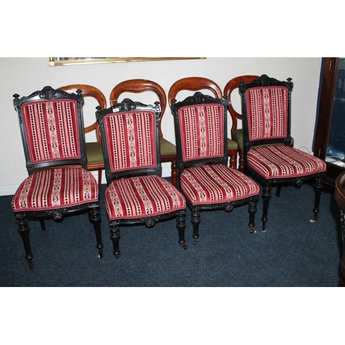 682 - Pair of ebonised and upholstered hall chairs and a pair of matching nursing chairs.