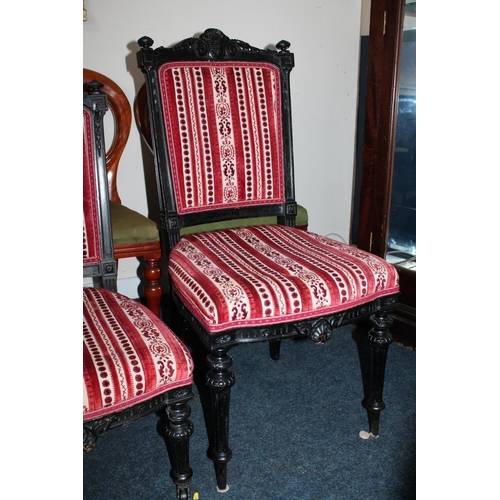 682 - Pair of ebonised and upholstered hall chairs and a pair of matching nursing chairs.