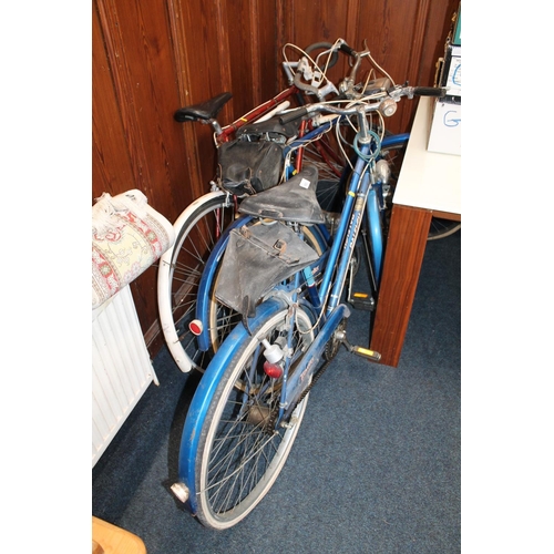 693 - Two vintage Raleigh Traveller bicycles and a vintage racing bike.