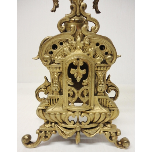 302 - French brass three-piece clock garniture in the Rococo taste, 20th century, comprising a large brack... 