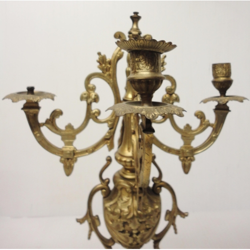 302 - French brass three-piece clock garniture in the Rococo taste, 20th century, comprising a large brack... 