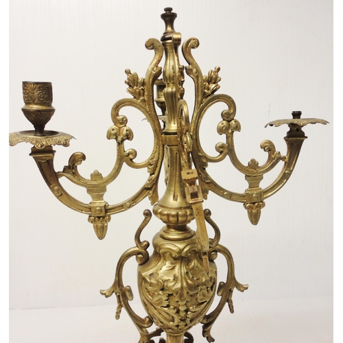 302 - French brass three-piece clock garniture in the Rococo taste, 20th century, comprising a large brack... 