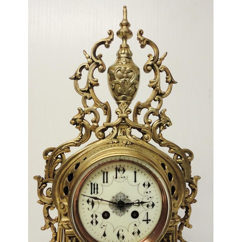 302 - French brass three-piece clock garniture in the Rococo taste, 20th century, comprising a large brack... 