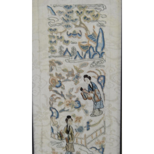 353 - Two framed Oriental sleeve panels, each 50cm x 9cm.  (2)