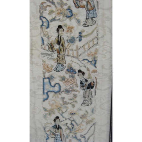 353 - Two framed Oriental sleeve panels, each 50cm x 9cm.  (2)