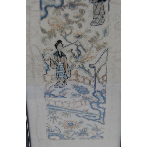 353 - Two framed Oriental sleeve panels, each 50cm x 9cm.  (2)