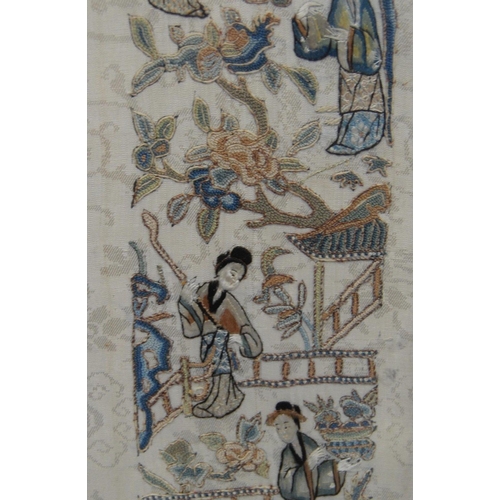 353 - Two framed Oriental sleeve panels, each 50cm x 9cm.  (2)