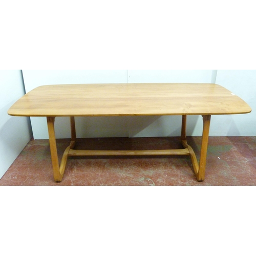 506 - Ercol beech and elm refectory table with ornate shaped supports to each end, united by beam stretche... 