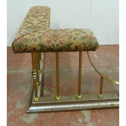 511 - Brass club fender with fabric-covered padded top, on tubular supports and fixed metal base, 50cm hig... 