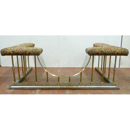 511 - Brass club fender with fabric-covered padded top, on tubular supports and fixed metal base, 50cm hig... 