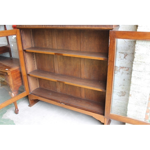 609 - Oak glazed bookcase.