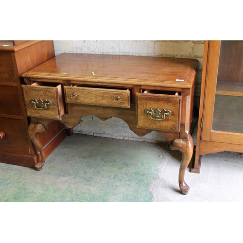 611 - Reproduction walnut effect lowboy.