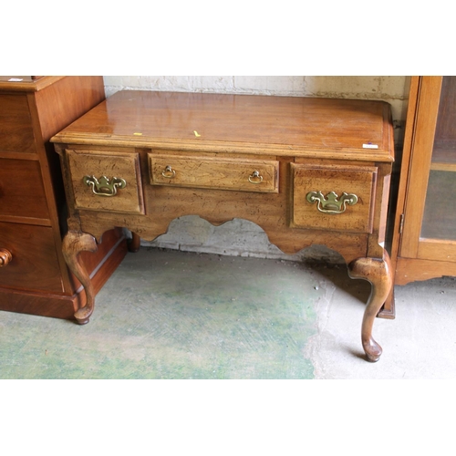 611 - Reproduction walnut effect lowboy.