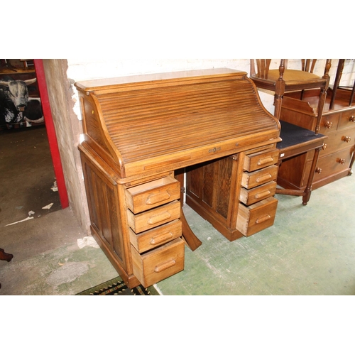 621 - Oak roll top desk, requires fixed assembly.