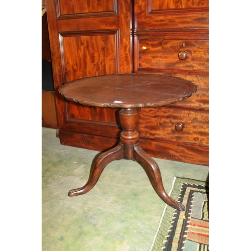 636 - Mahogany occasion table raised on tripod base.