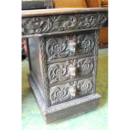 642 - Heavily carved Victorian oak pedestal desk, 138cm wide.