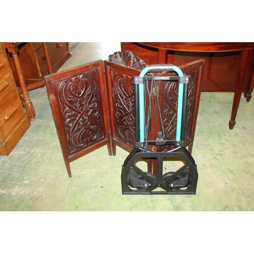 649 - Carved oak folding screen and a Vonroc trolley.