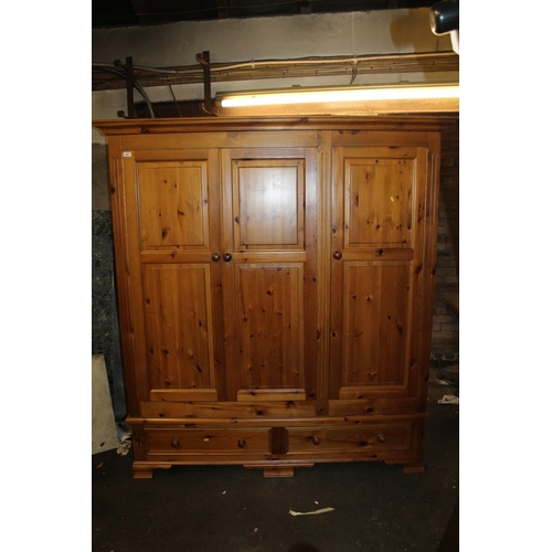 659 - Pine three door wardrobe.