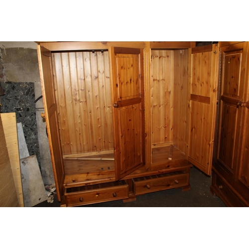 659 - Pine three door wardrobe.