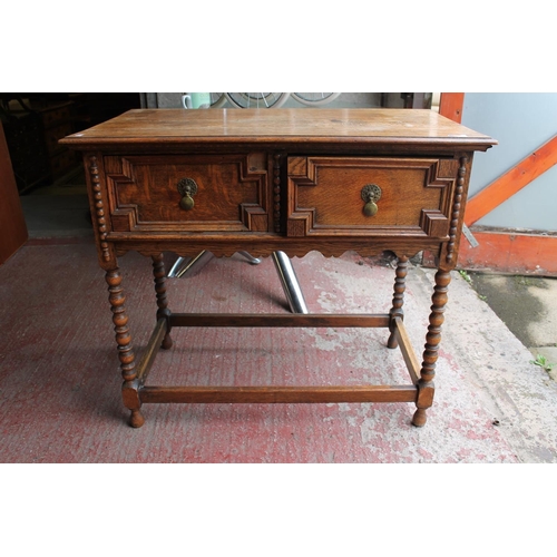 665 - Edwardian oak hall table with two under tier drawers.