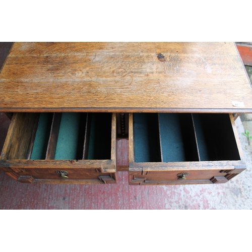 665 - Edwardian oak hall table with two under tier drawers.