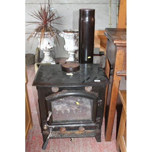 670 - Cast iron wood burner.