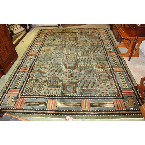 678 - Large green rug.