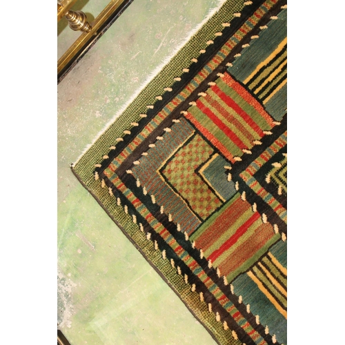 678 - Large green rug.