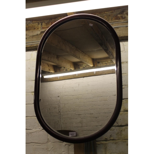 613 - Oval wall mirror.