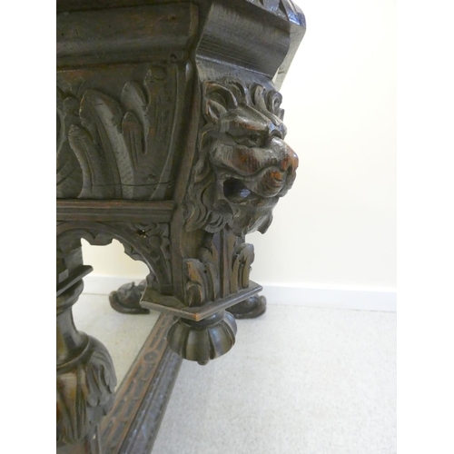 365 - Jacobean revival oak library table, the octagonal top with moulded decoration, above single drawer w... 