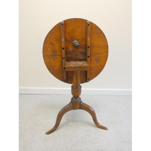 372 - Antique country elm tilt top tripod table. Height 65cm,  57cm diameter.