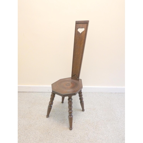 373 - 20th century dark oak spinning chair on bobbin turned supports. Height 92cm.