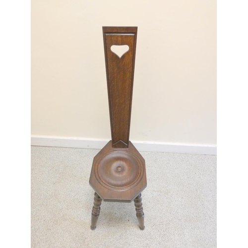 373 - 20th century dark oak spinning chair on bobbin turned supports. Height 92cm.