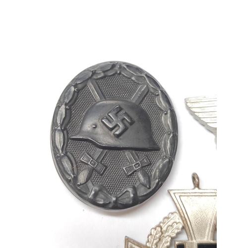 291 - Germany Third Reich: Awards to include a 1939 Wound Badge, Military Police Cap Badge, and 25 years F... 