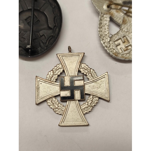 291 - Germany Third Reich: Awards to include a 1939 Wound Badge, Military Police Cap Badge, and 25 years F... 