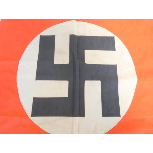 307 - German Third Reich NSDAP podium drape. Single sided red cotton with applied white disc bearing stitc... 