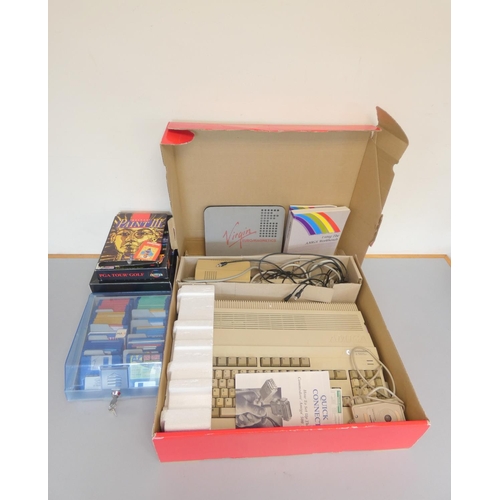 107 - A boxed Commodore Amiga 500 console together with a selection of games to include A320 Airbus flight... 