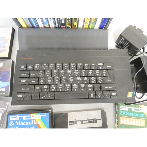 108 - Sinclair ZX Spectrum gaming console along with a selection of games. 