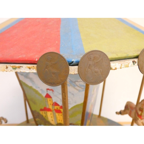 114 - Vintage scratch built wooden carousel in bright polychrome painted finish, the canopy with applied B... 