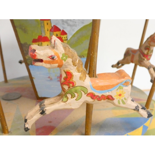 114 - Vintage scratch built wooden carousel in bright polychrome painted finish, the canopy with applied B... 