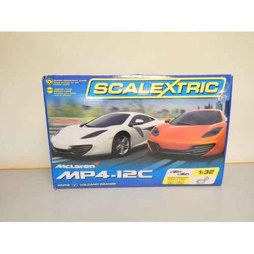 115 - Scalextric. Boxed 1:32 scale McLaren MP4-12C racing set C1284. 