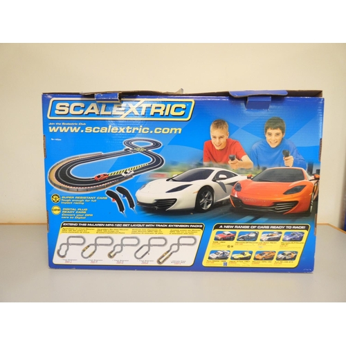 115 - Scalextric. Boxed 1:32 scale McLaren MP4-12C racing set C1284. 