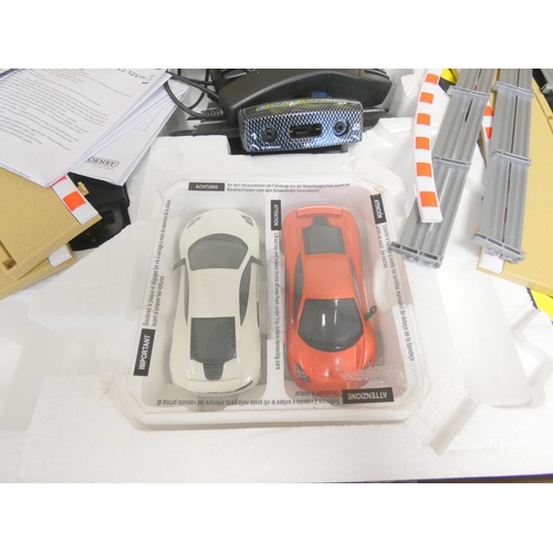 115 - Scalextric. Boxed 1:32 scale McLaren MP4-12C racing set C1284. 