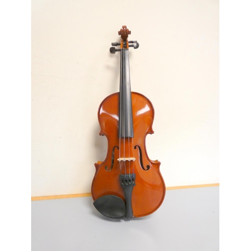 424 - 1/4 scale violin by Primavera, spruce top with two piece maple back. With case and bow.