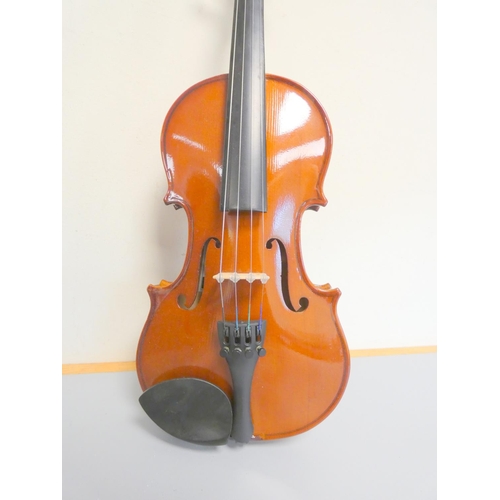 424 - 1/4 scale violin by Primavera, spruce top with two piece maple back. With case and bow.