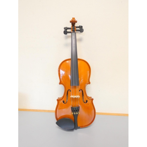 425 - 1/8 scale student violin by Stentor, spruce top with two piece maple back. With case and bow.