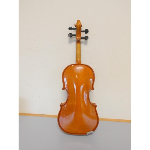 425 - 1/8 scale student violin by Stentor, spruce top with two piece maple back. With case and bow.