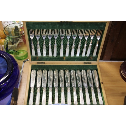 185 - Cased canteen of mother-of-pearl handled silver-plated fish knives and forks.