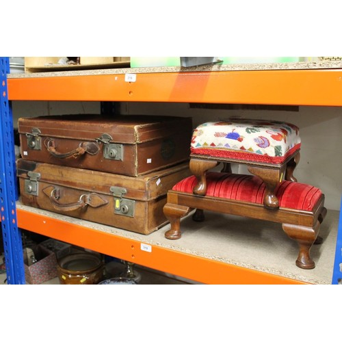 317 - Two leather briefcases and two footstools.